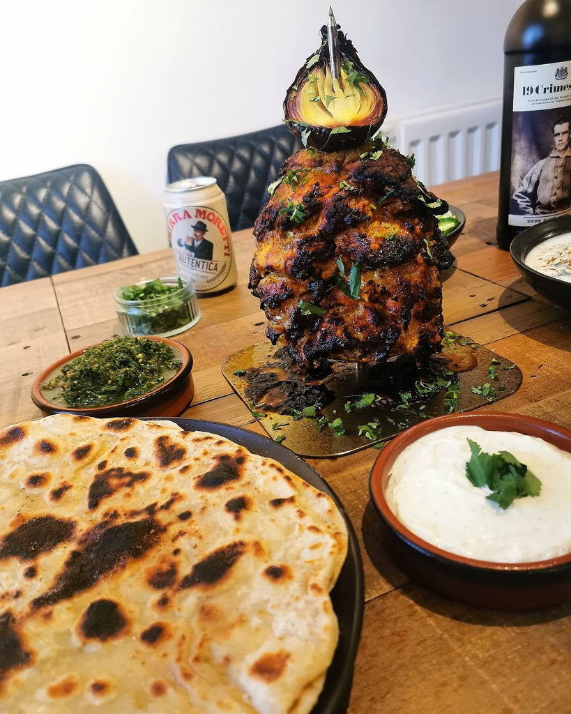 Kebab Spike and chicken tikka on the Kebab Spike from the Kebab Spike Co, Homemade flatbreads garlic mayo raita chilli chutney 